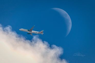 Frontier Airlines passing in front of the moon | Photography Lessons | TJ Waller Photography