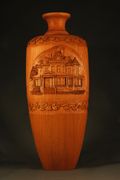 From log to urn with the Holly Lawn home hand carved on the face.