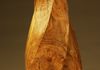 This hollowed white oak vase was turned first then the helicitcal channels were carved.  18"