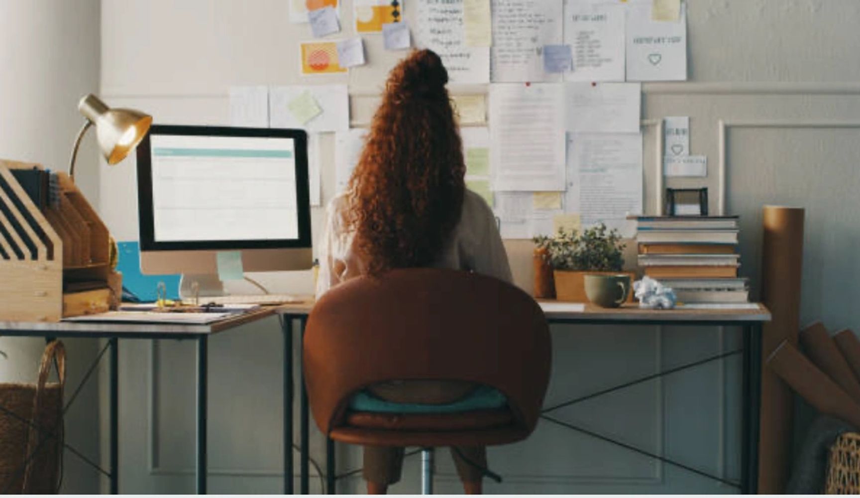 Woman sitting at a desk, working