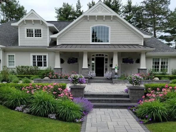 Beautiful house with a well-maintained garden and stone pathway.