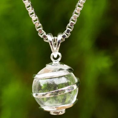 Clear quartz pendant wrapped in sterling silver on a Venetian chain.