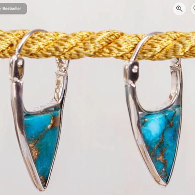 Sterling silver hoop earrings with pointed composite turquoise drops.