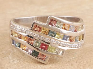 Rhodium-plated ring with multicolored sapphires and cubic zirconia.