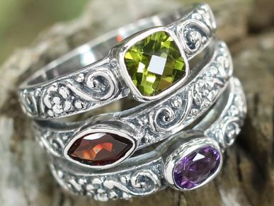 Sterling silver cocktail ring with peridot, garnet, and amethyst.