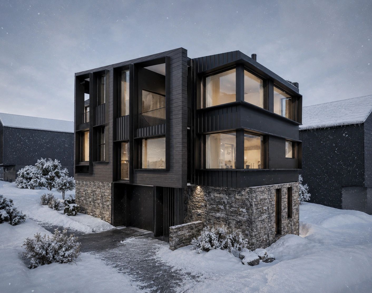 Modern stone and black wood house in snowy winter landscape at dusk.