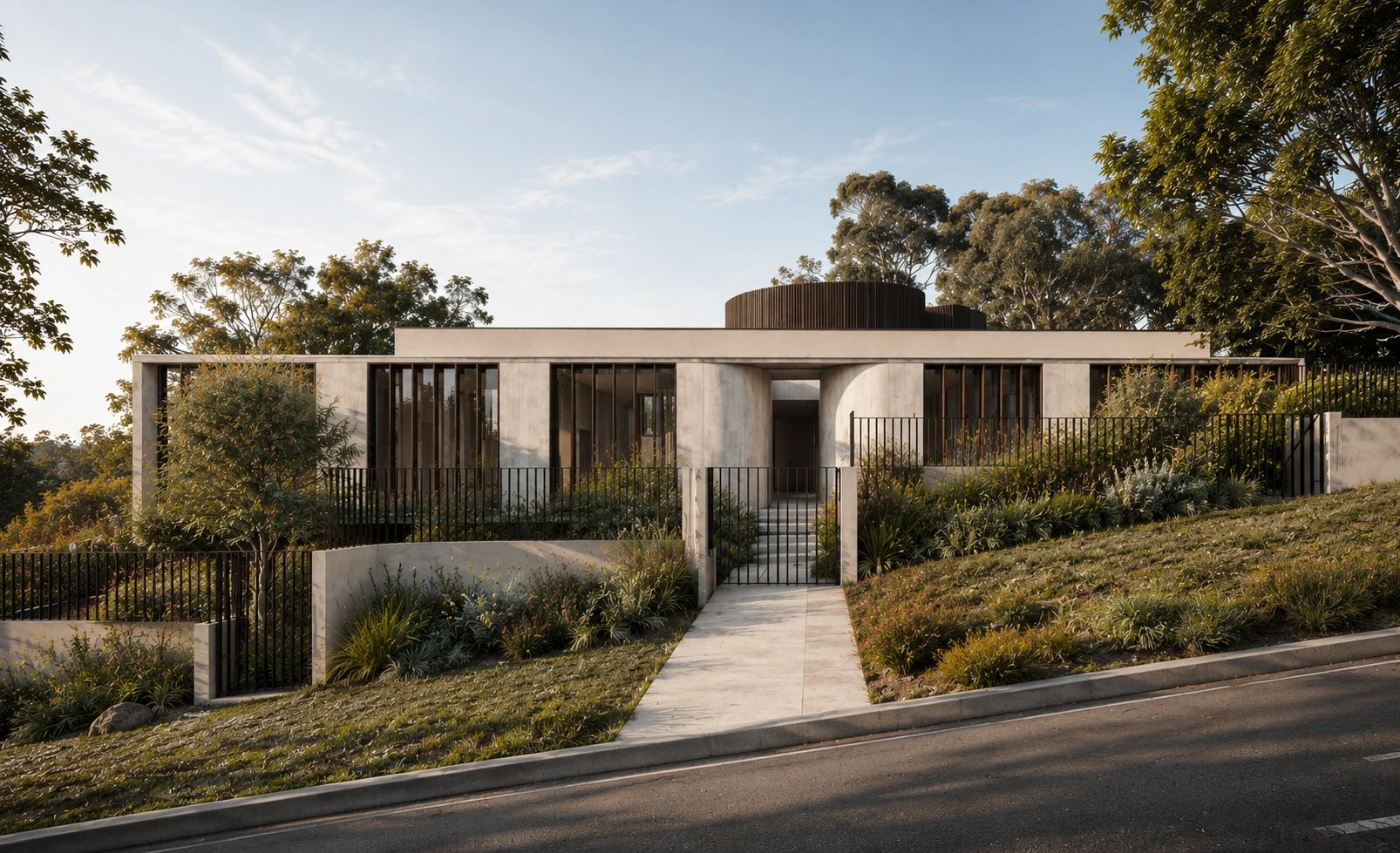 Modern minimalist house with concrete facade and lush landscaping on a sloped street.