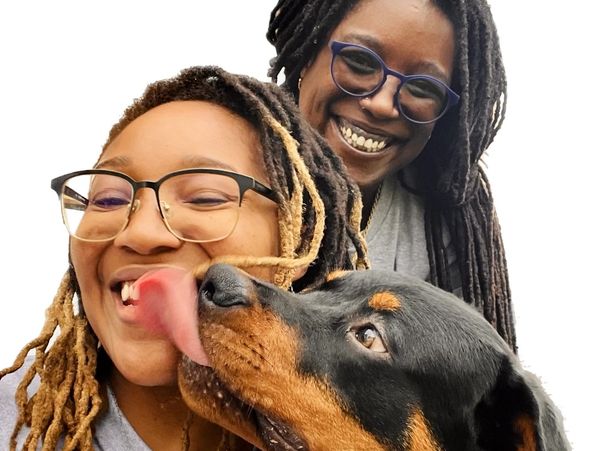 Elsie's Pet Palace - Regina and Elise getting kisses from Ace during a drop-in visit.