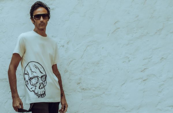 The Hypnotized 1015 Androgynous Skull T in vintage off white. Screen printed by hand on 100% cotton shirts.