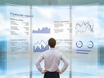 Man analyzing futuristic financial report with charts and data.
