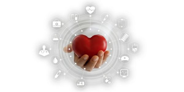 Hand holding a heart surrounded by healthcare icons symbolizing medical care and support.