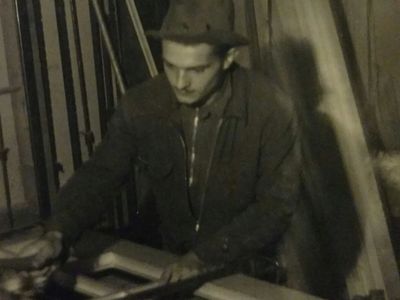 Joe Bean working on wood door.