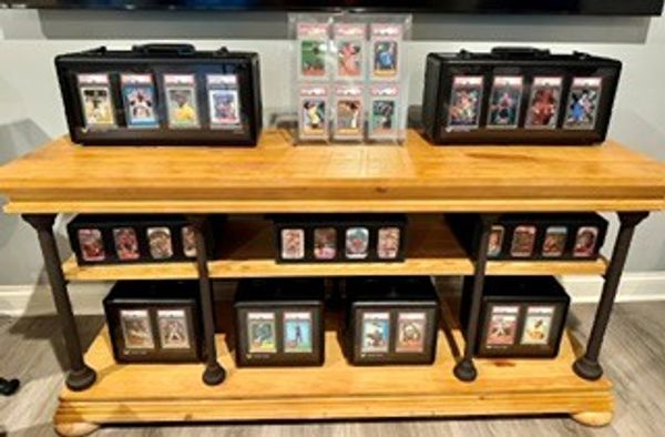 Special thanks to Dustin N. for this picture of his PSA-graded sports cards, modern top-loaded GOATS