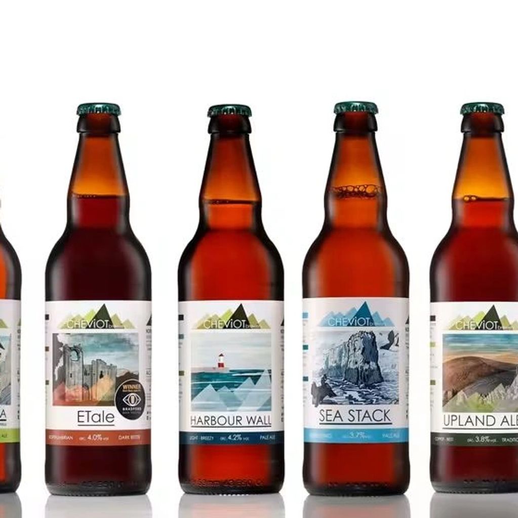 A lineup of seven Cheviot craft beer bottles with distinct labels.