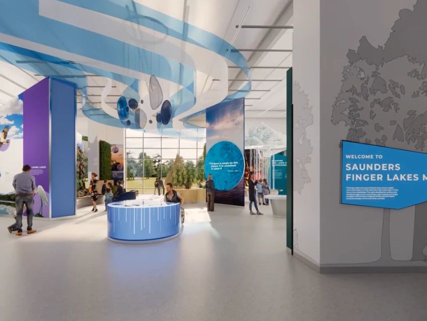 Modern museum interior with blue-themed exhibits and visitors exploring Saunders Finger Lakes nature.