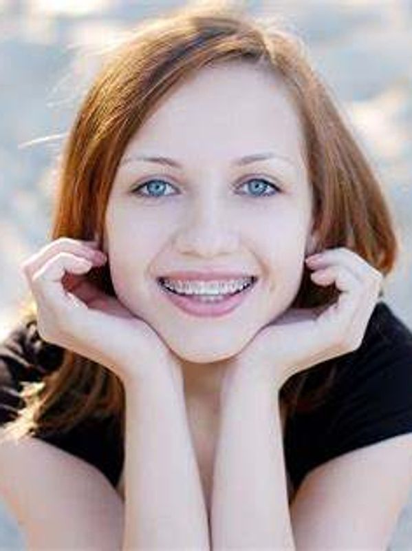 Girl showing braces on teeth