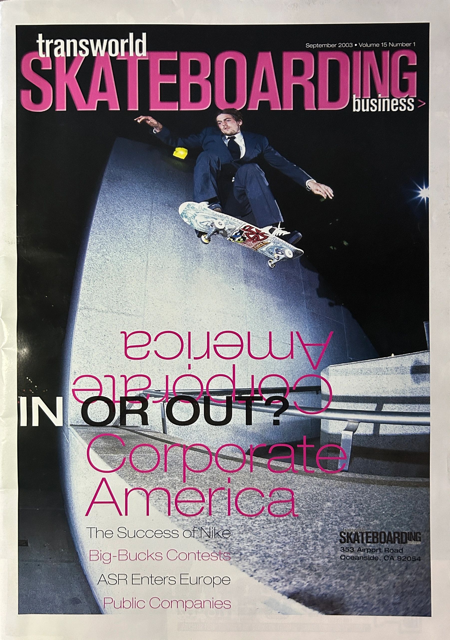 Skateboarder in a suit jumps over a stair rail on Transworld Skateboarding cover.