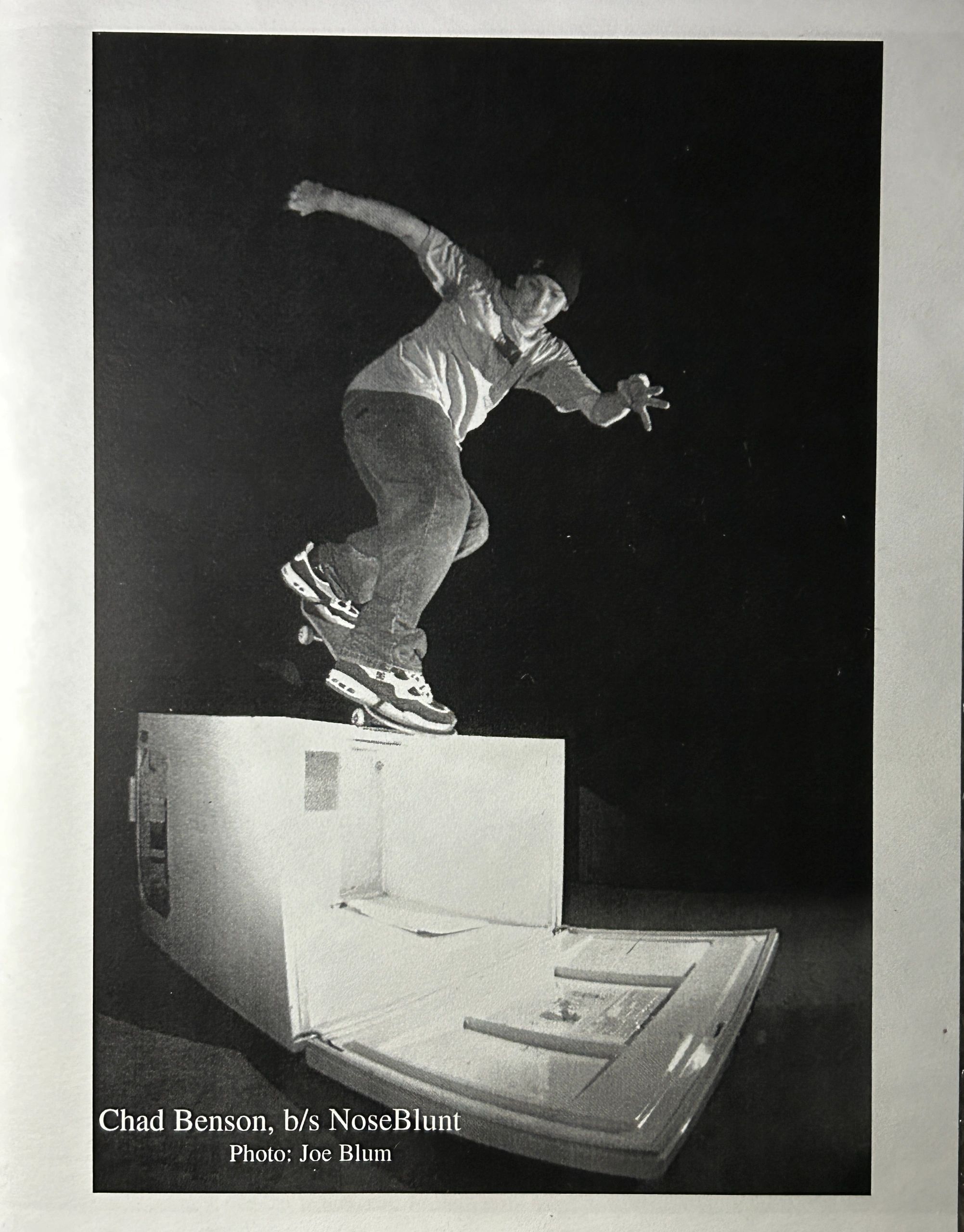Skateboarder Chad Benson performing a backside NoseBlunt at night.