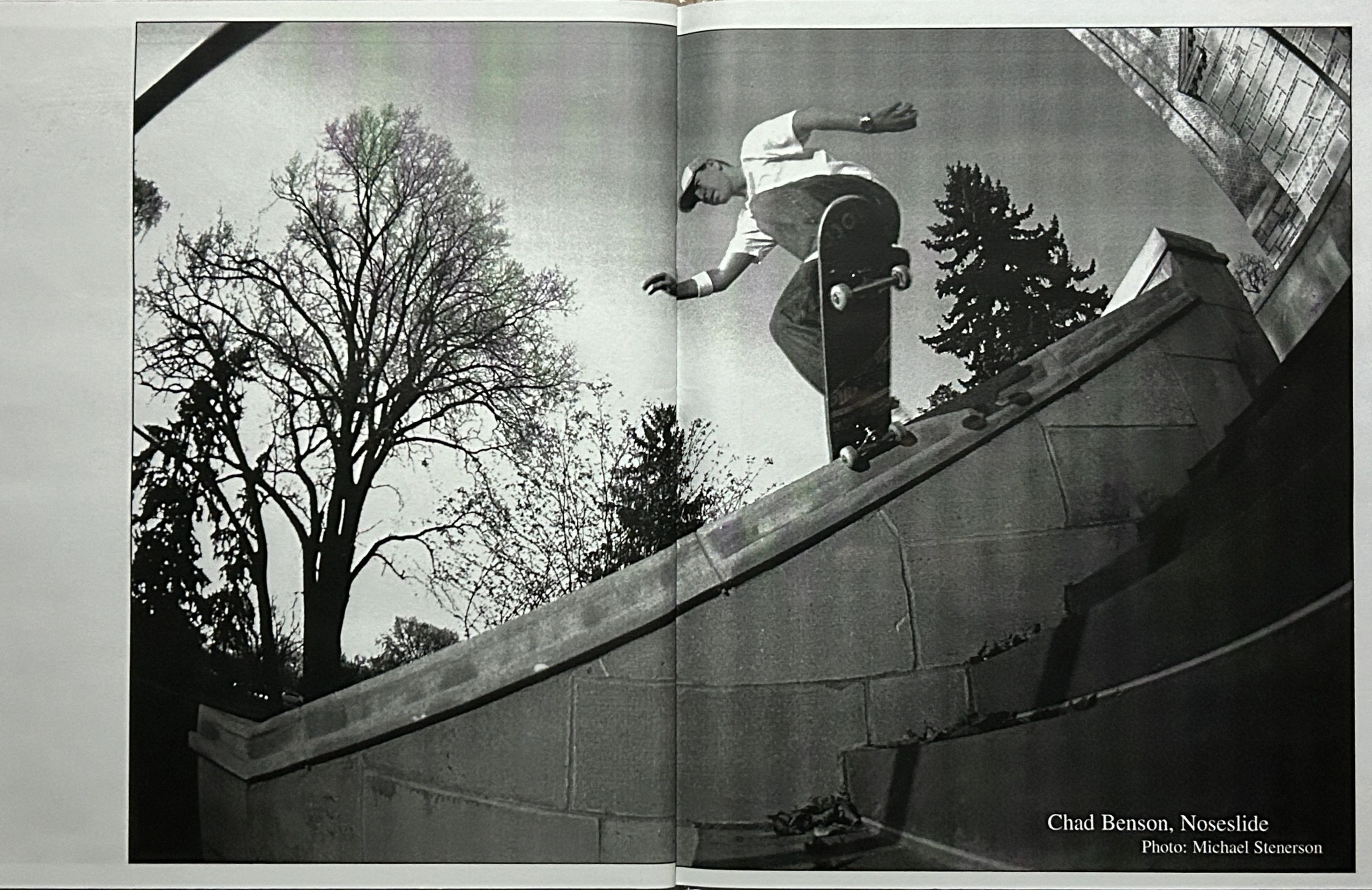 Skateboarder Chad Benson performing a noseslide on a ledge outdoors.