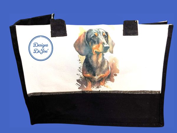 A black and white canvas hand bag tote adorned with a smooth dashund.