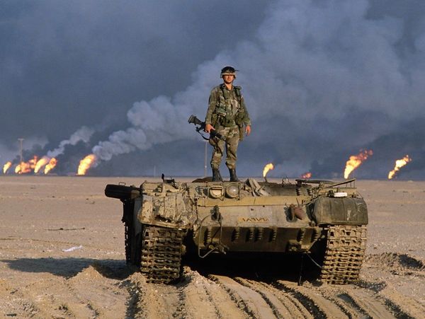 Desert Storm 1991. Destroyed tank during Iraq war. Burning oil fields. Kuwati invasion. 