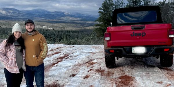 Owners, Alyssa and Parker wheeling in Red Jeep Gladiator