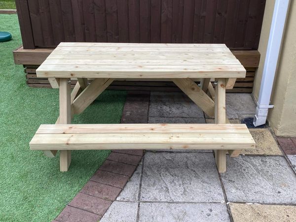 Children's outdoor wooden picnic table with bench seats