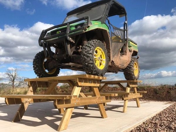 Heavy duty wooden picnic table with bench seats
