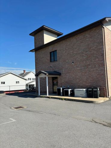 A brick building with appliances outside.