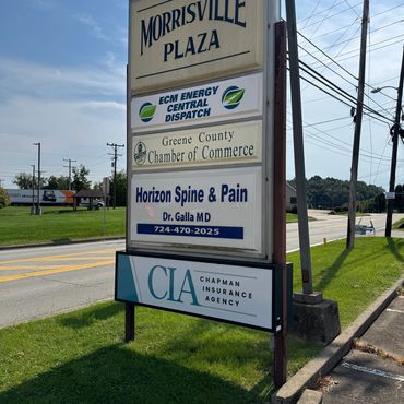 Signboard listing businesses in Morrisville Plaza.