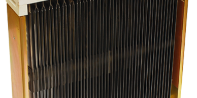 A rectangular metal heat sink with vertical fins and mounting brackets.