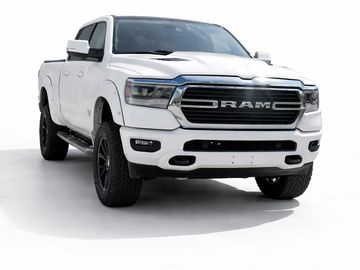White RAM pickup truck with black accents on a white background.