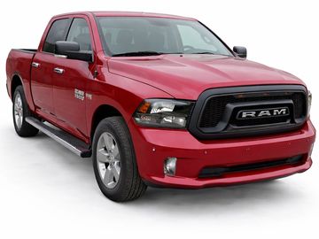 Red RAM pickup truck with black grille and chrome wheels.