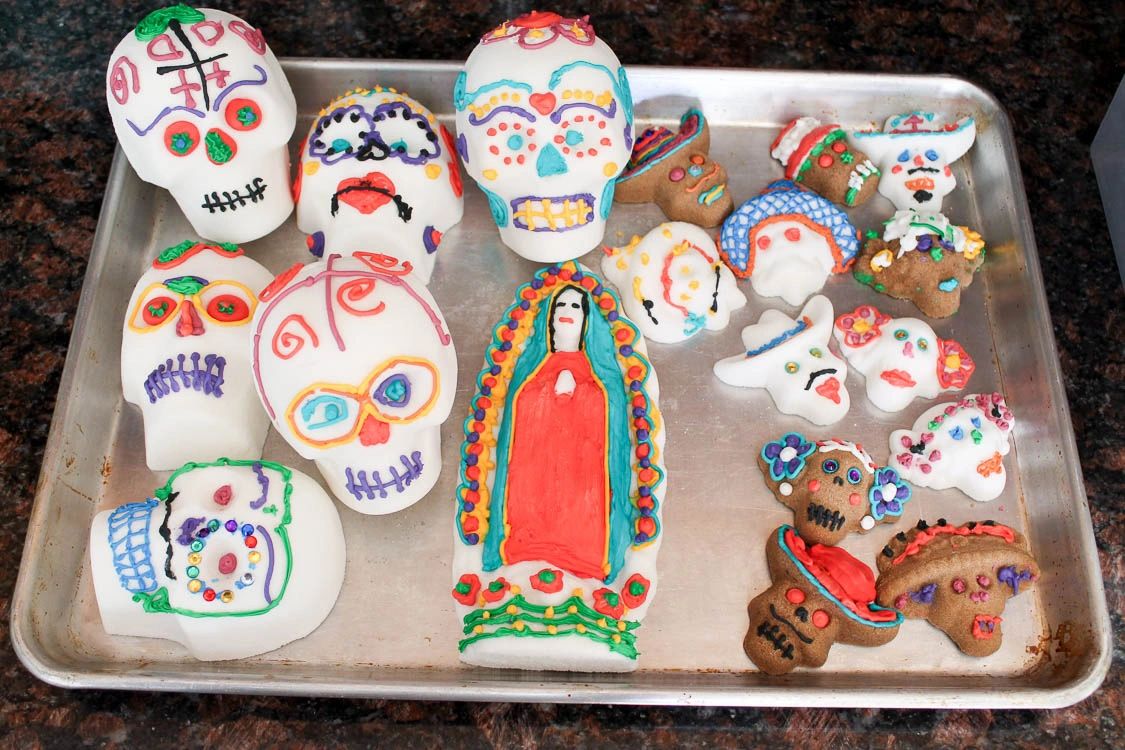 An arrangement of different sugar skulls decorated with royal icing.