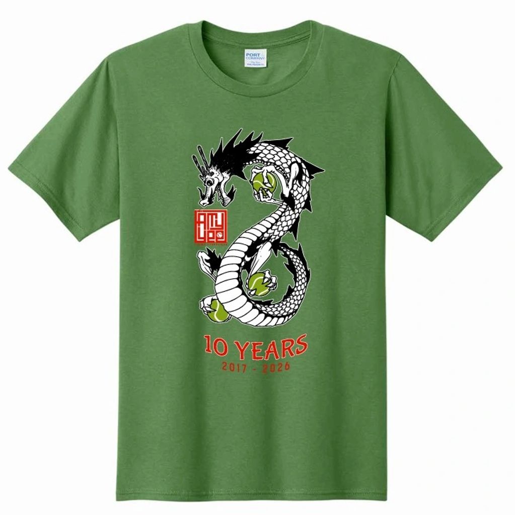 Green T-shirt with a black and white dragon holding green orbs, celebrating 10 years from 2017 to 2026.