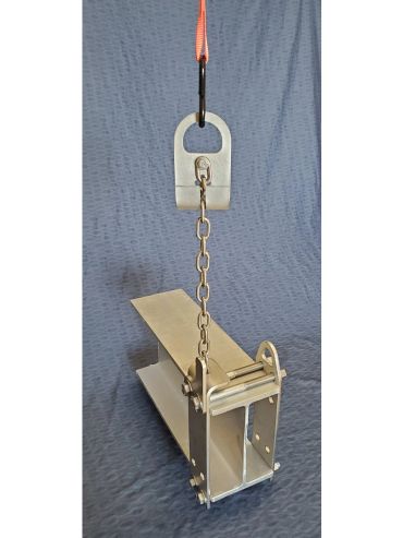 A metal lifting beam with chain and hook against a gray background.