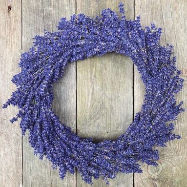 A dried lavender Hidcote wreath on a wooden background 