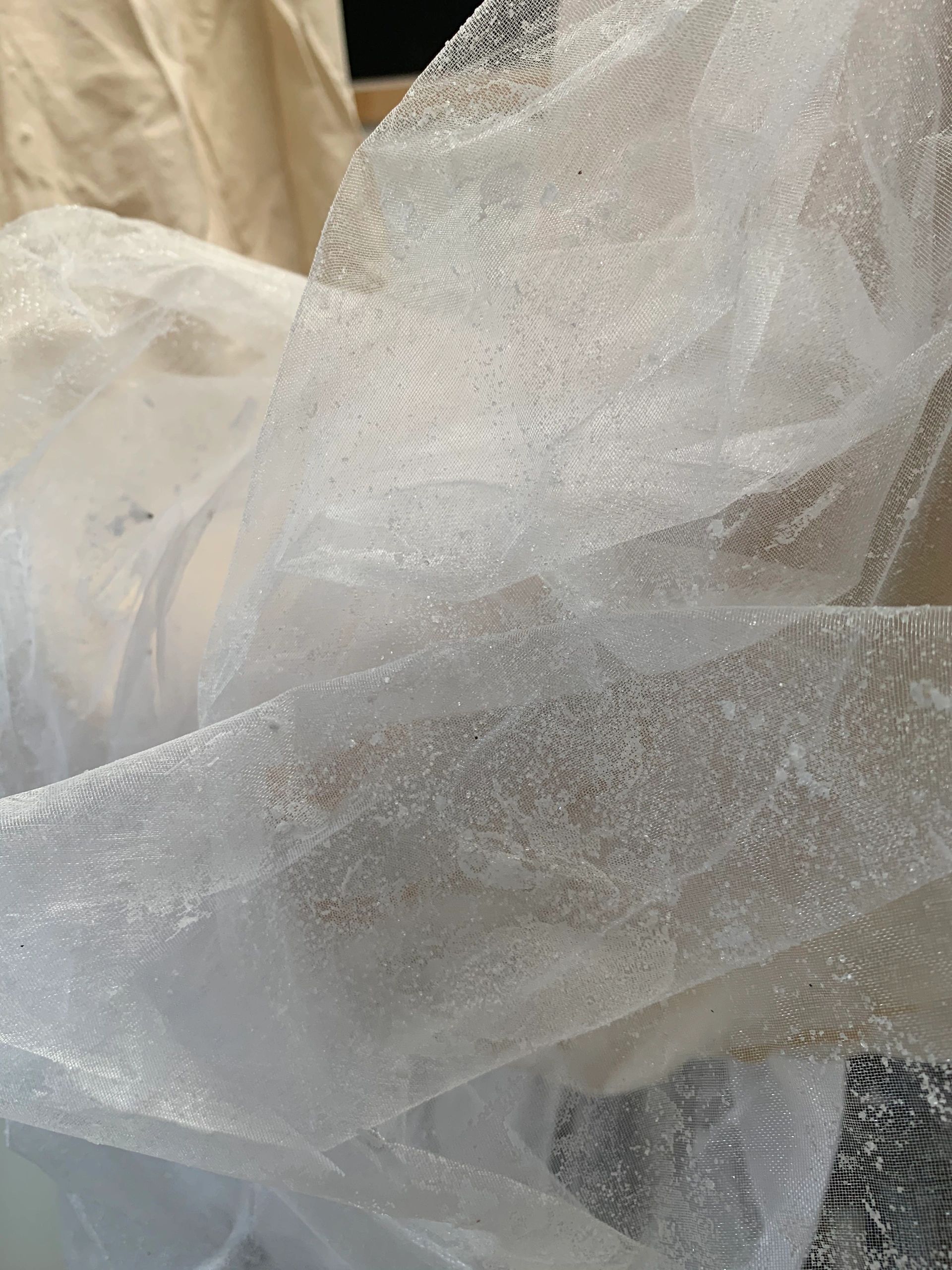 Scrunched up semi-transparent white fabric.