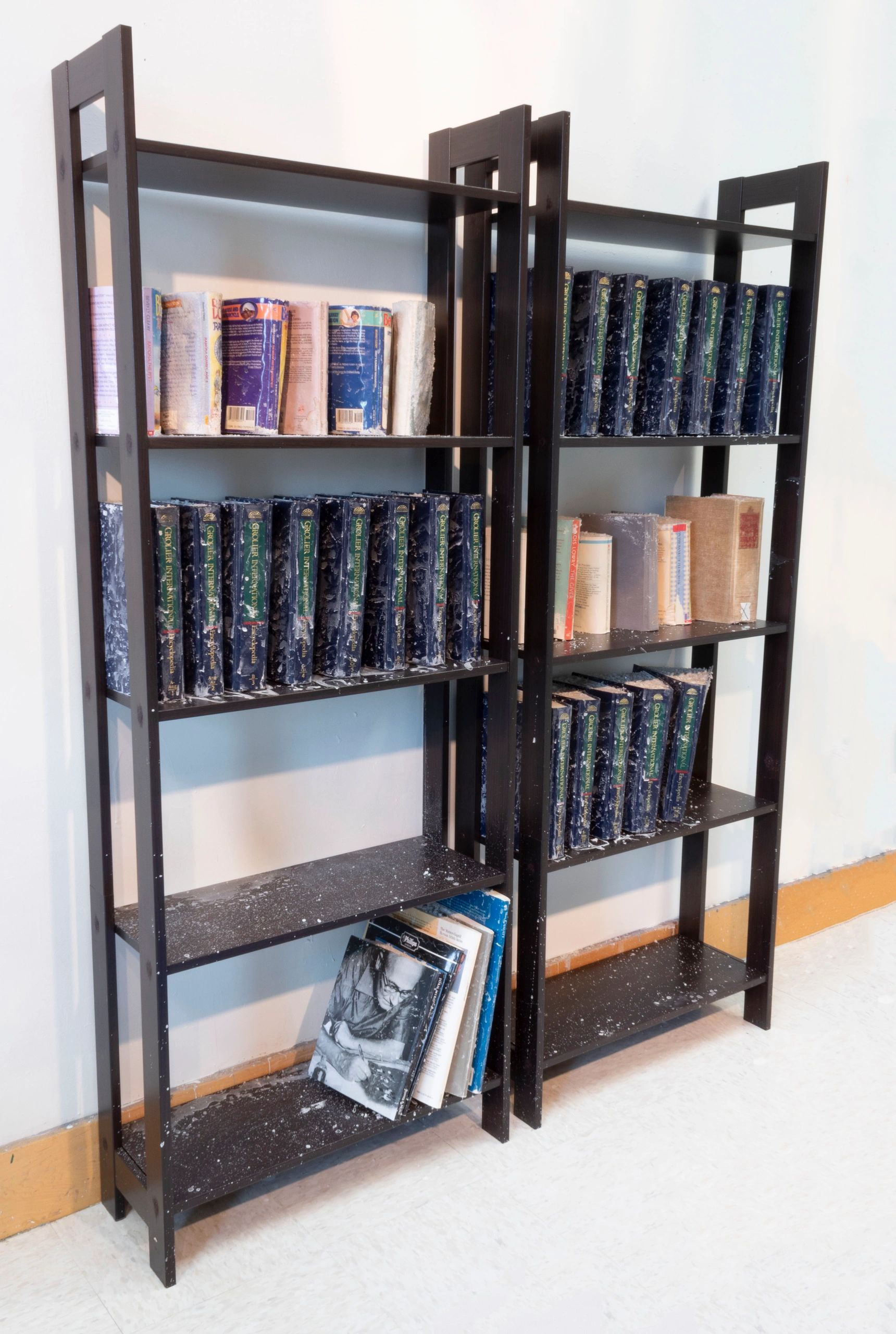 Books on a bookshelf at an angle