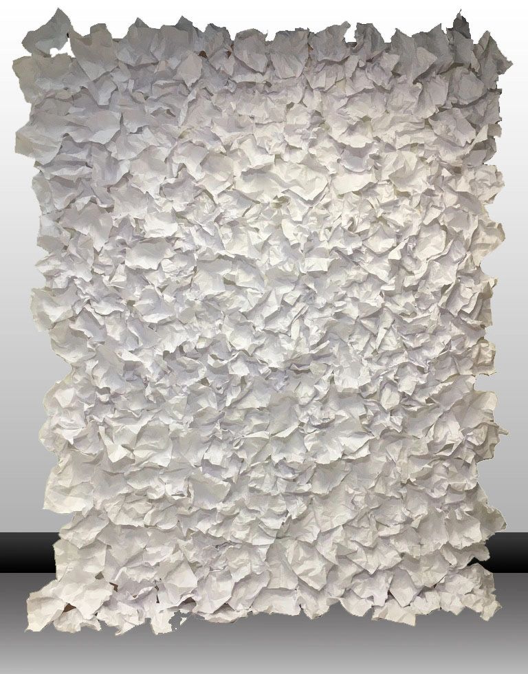 Crinkled copy paper on a wall