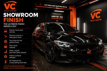 Sleek black BMW in a valet centre with detailed showroom finish services.