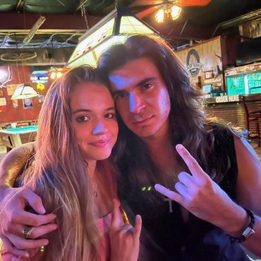 Jake Curtis Allard and his beautiful girlfriend Aria in San Marcos Texas throwing up the horns