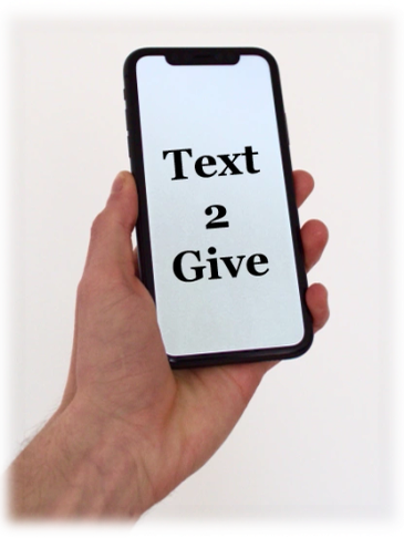 Hand holding phone displaying 'Text 2 Give' message.