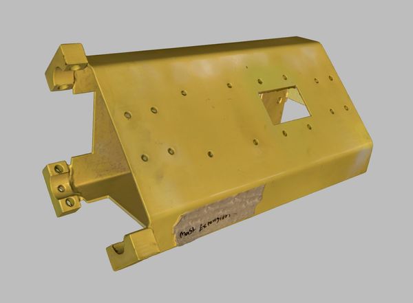 Yellow metal object with a triangular shape and a square cutout.