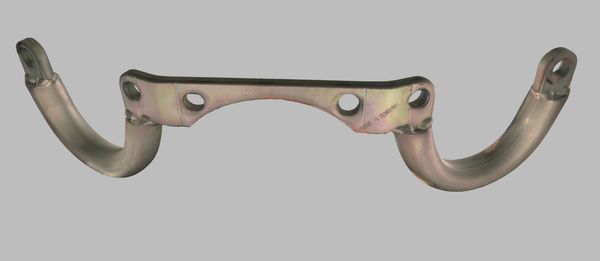 Metal automotive part with curved arms and mounting holes.