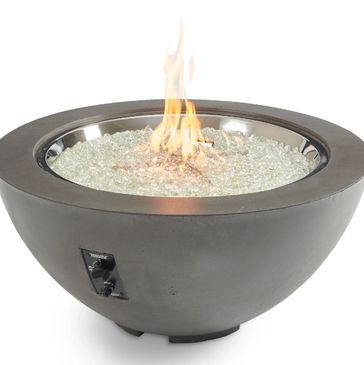 Modern fire pit with glass stones and flame.