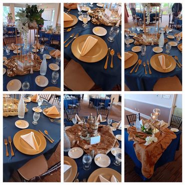 Elegant tables set with navy blue tablecloths, gold plates, and cream napkins for a formal event.