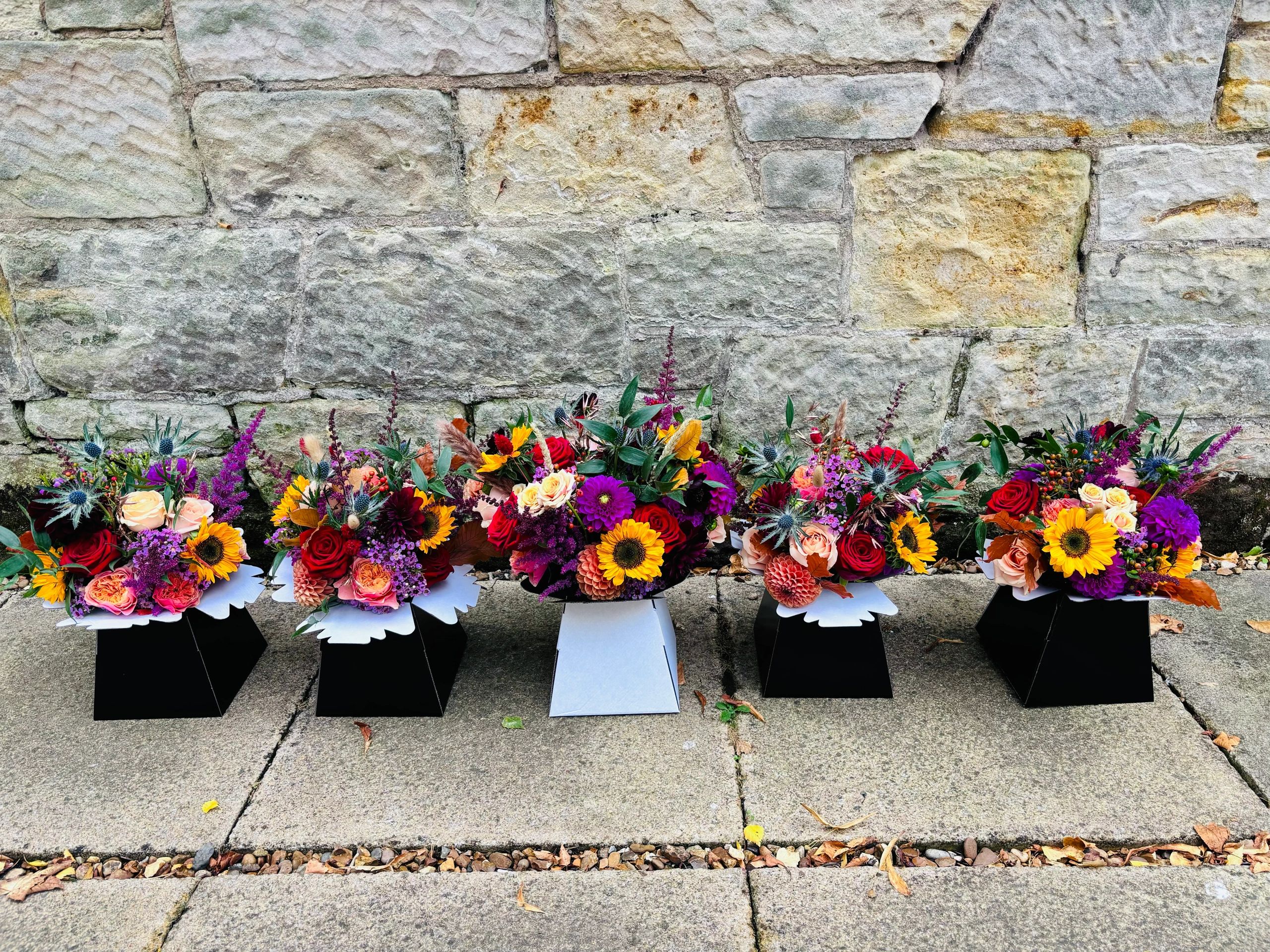 Autumnal wedding flowers at rufflets hotel in St Andrews Fife, sunflowers and roses, bridal bouquet