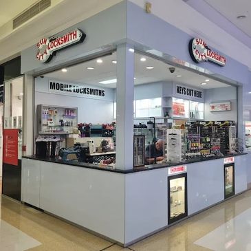 A locksmith shop inside a shopping center