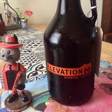 Photo of Elevation 66 growler with SF Louie bobble head on beautiful mat from Kiss the Frog  warehou